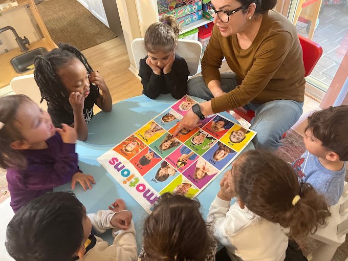 Shadi Mirshahi leading circle time on emotions with toddlers at Happy Palm Daycare in Irvine, CA