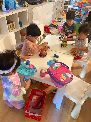 Toddlers learning together at Happy Palm Daycare Irvine